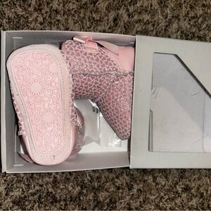 Gently used pink baby UGG boot size 0/1